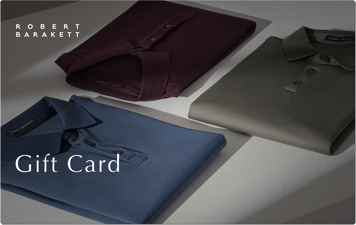 Robert Barakett gift card displayed with folded polo shirts in navy, burgundy, and sage green.