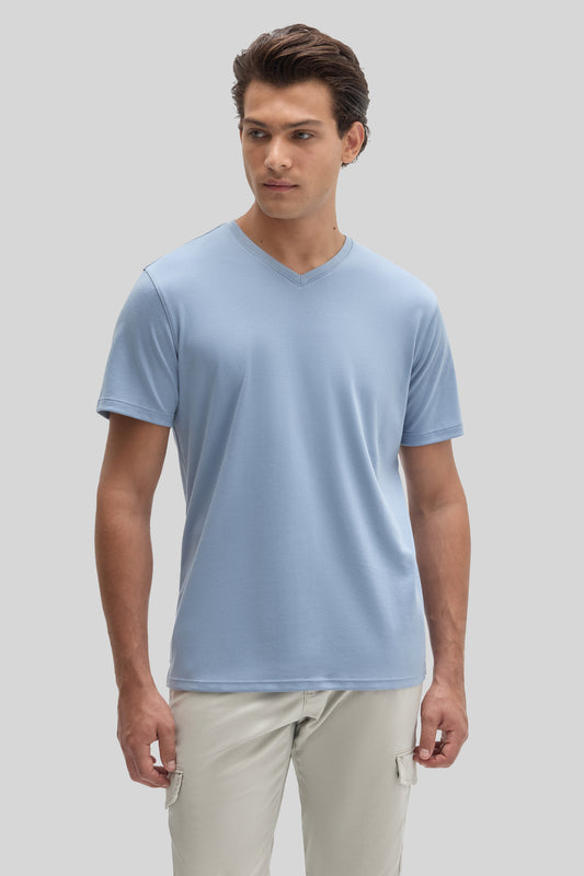 Man wearing light blue V-neck short-sleeve t-shirt with beige cargo pants.