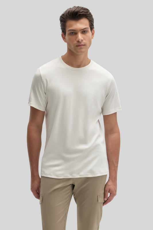 Man wearing cream-colored short-sleeve crew neck t-shirt with beige cargo pants.