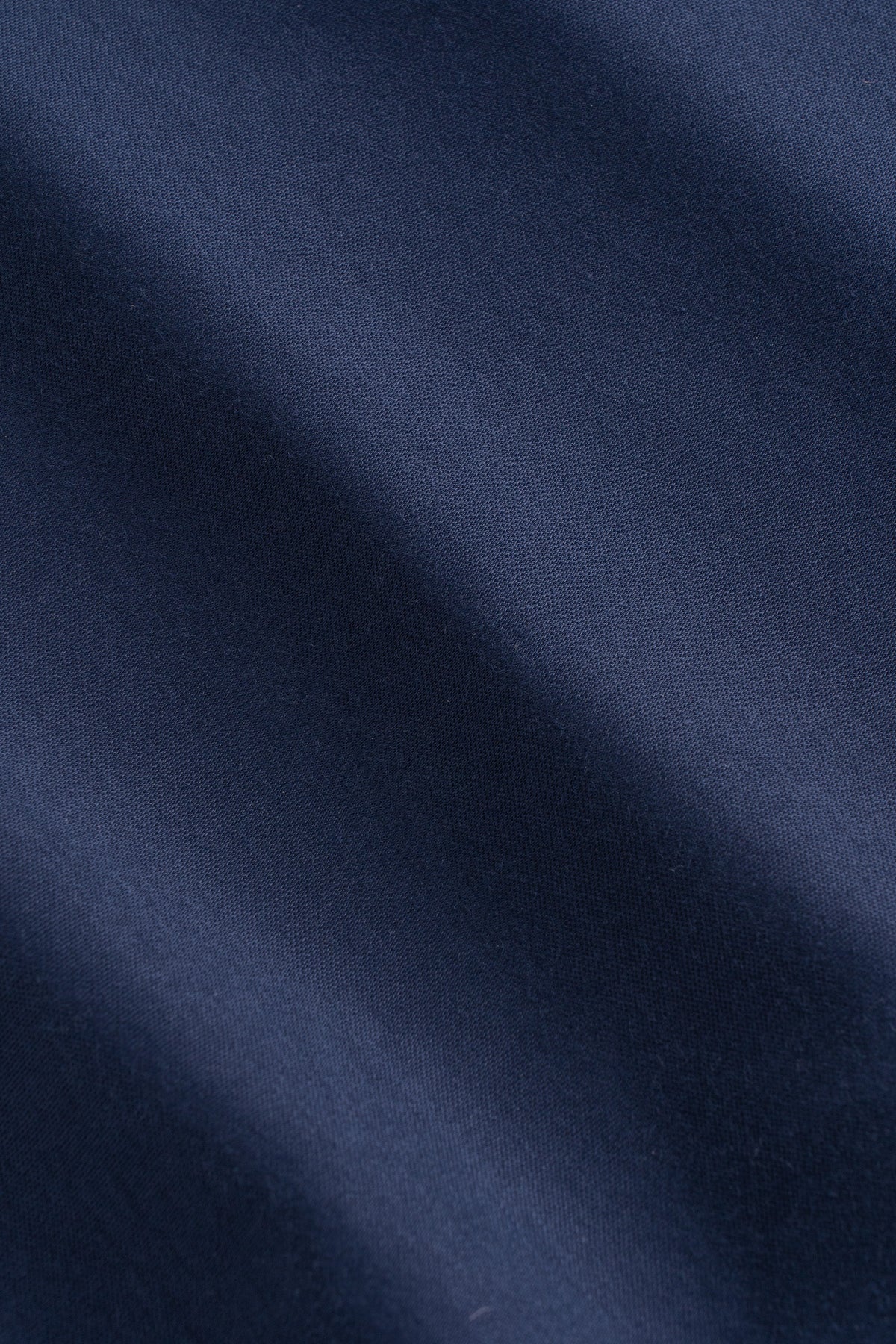 Navy blue ribbed knit tee with V-neckline and textured fabric detail.