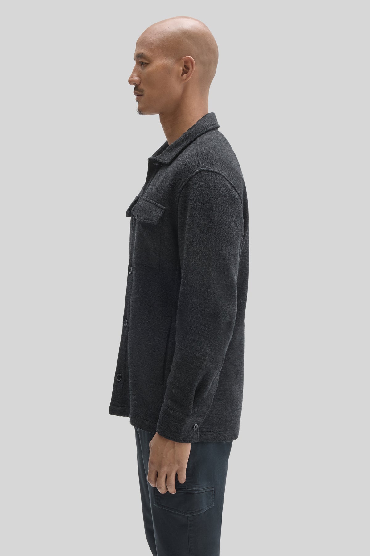 Charcoal gray overshirt with collared neckline, button front closure, and chest pocket, displayed on mannequin.