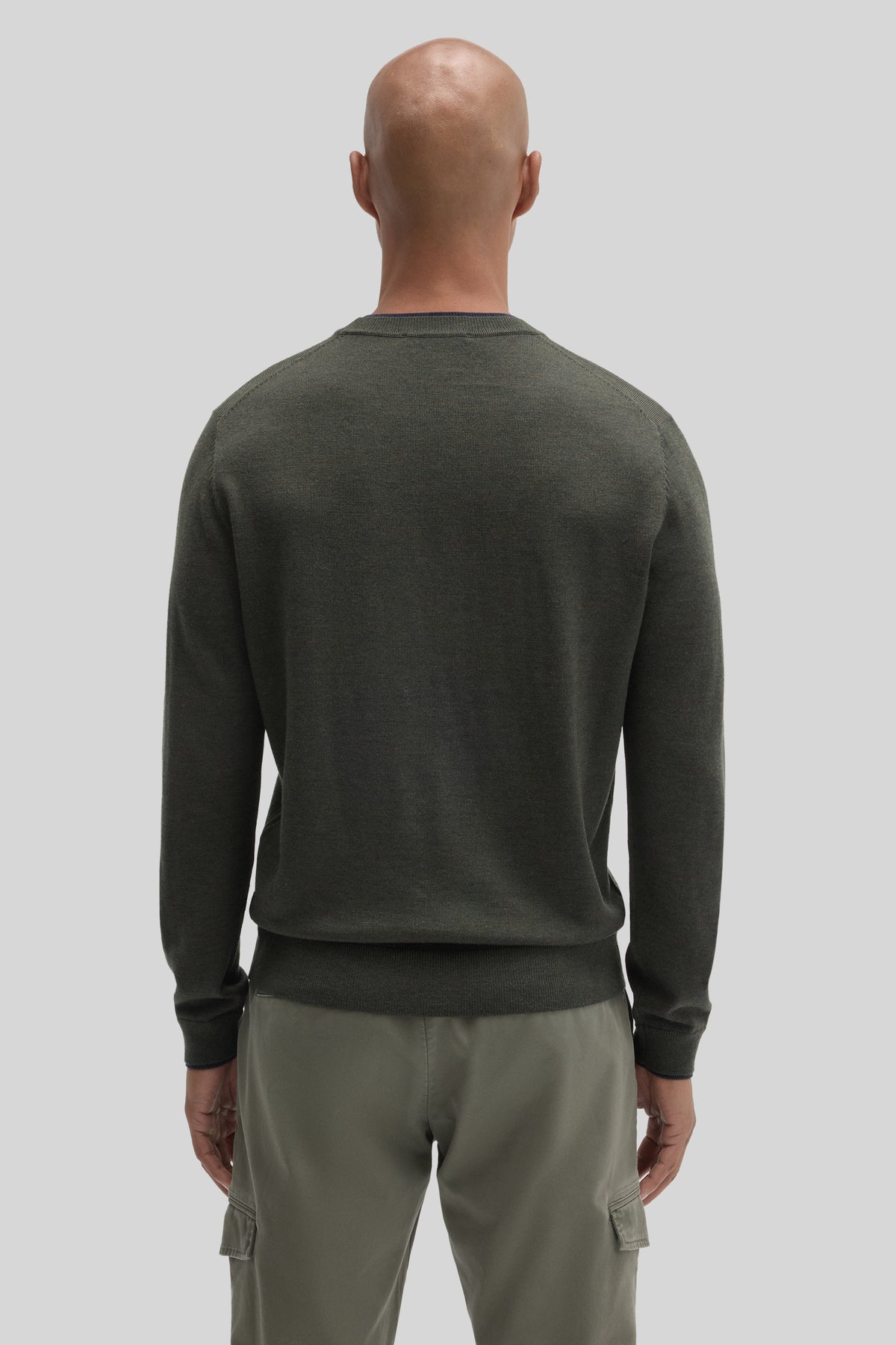 Charcoal gray crewneck sweater with ribbed cuffs and hem, shown from back on a male model.