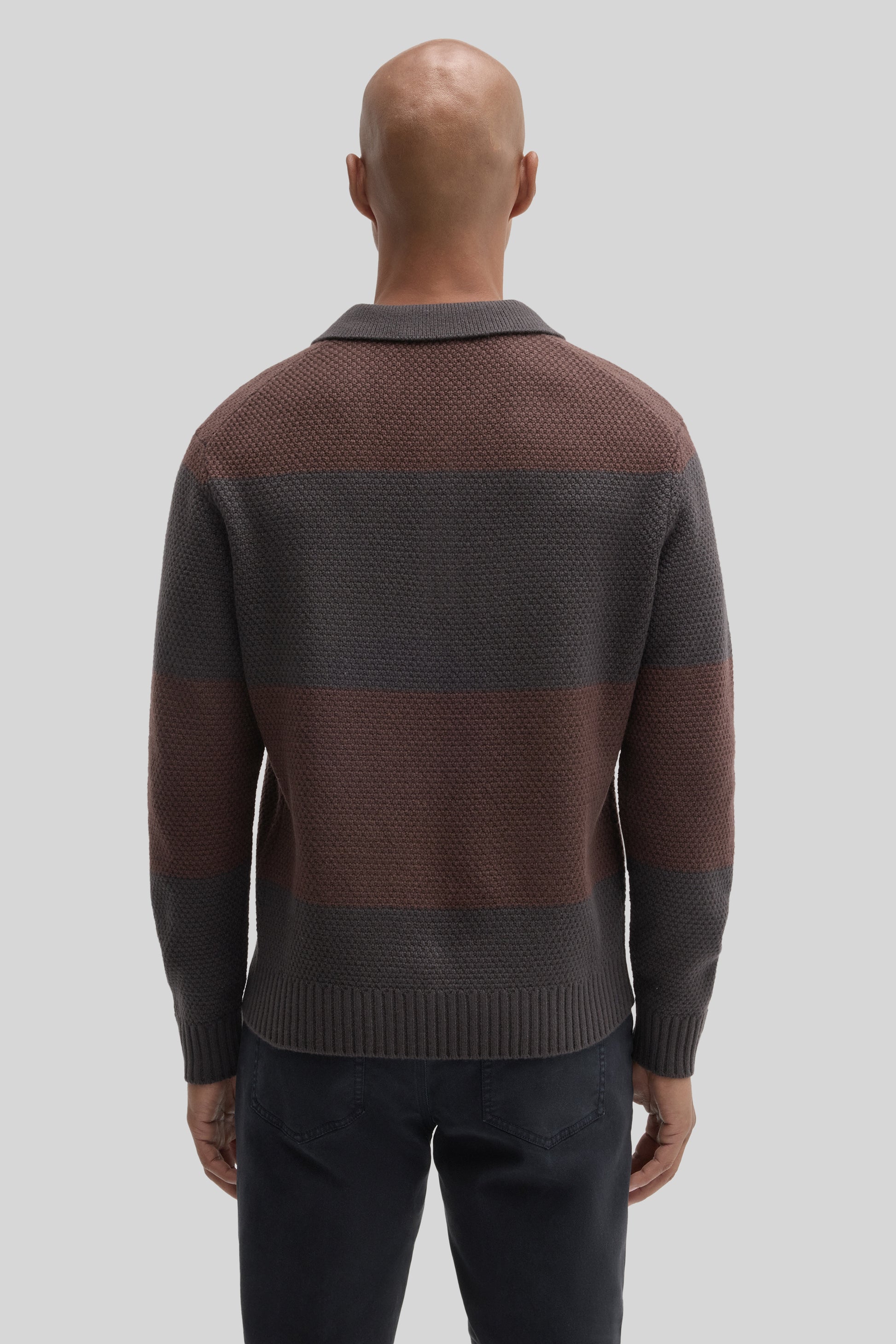 Brown and charcoal rugby polo sweater with textured knit fabric and ribbed collar, shown from back view.