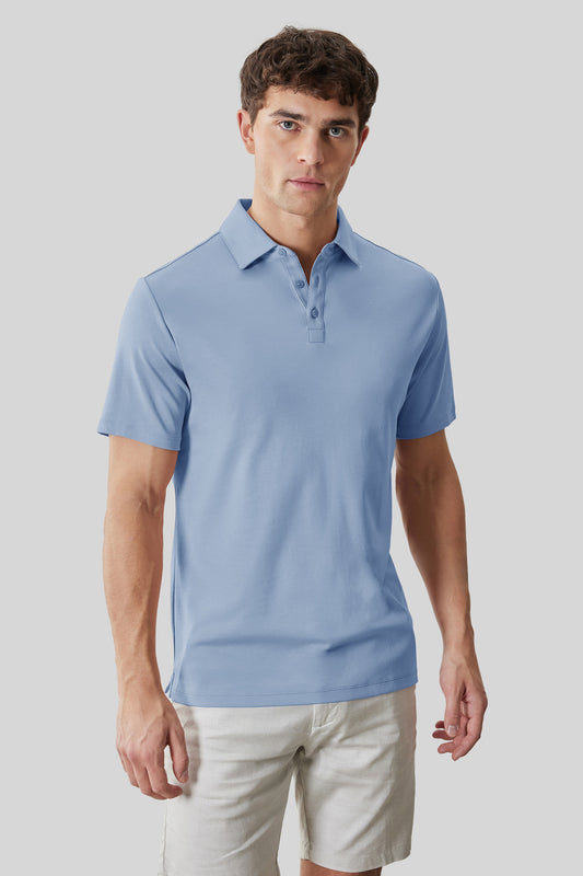 Man wearing light blue short-sleeve polo shirt with collar and button placket, paired with cream shorts.