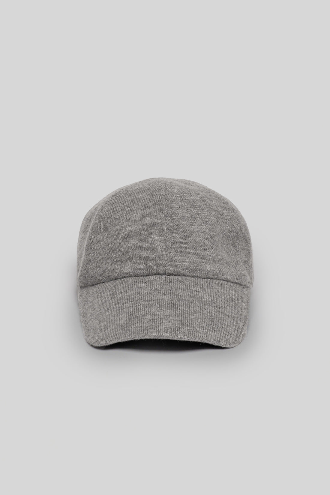 Gray knit baseball cap with ribbed texture and rounded crown viewed from front.