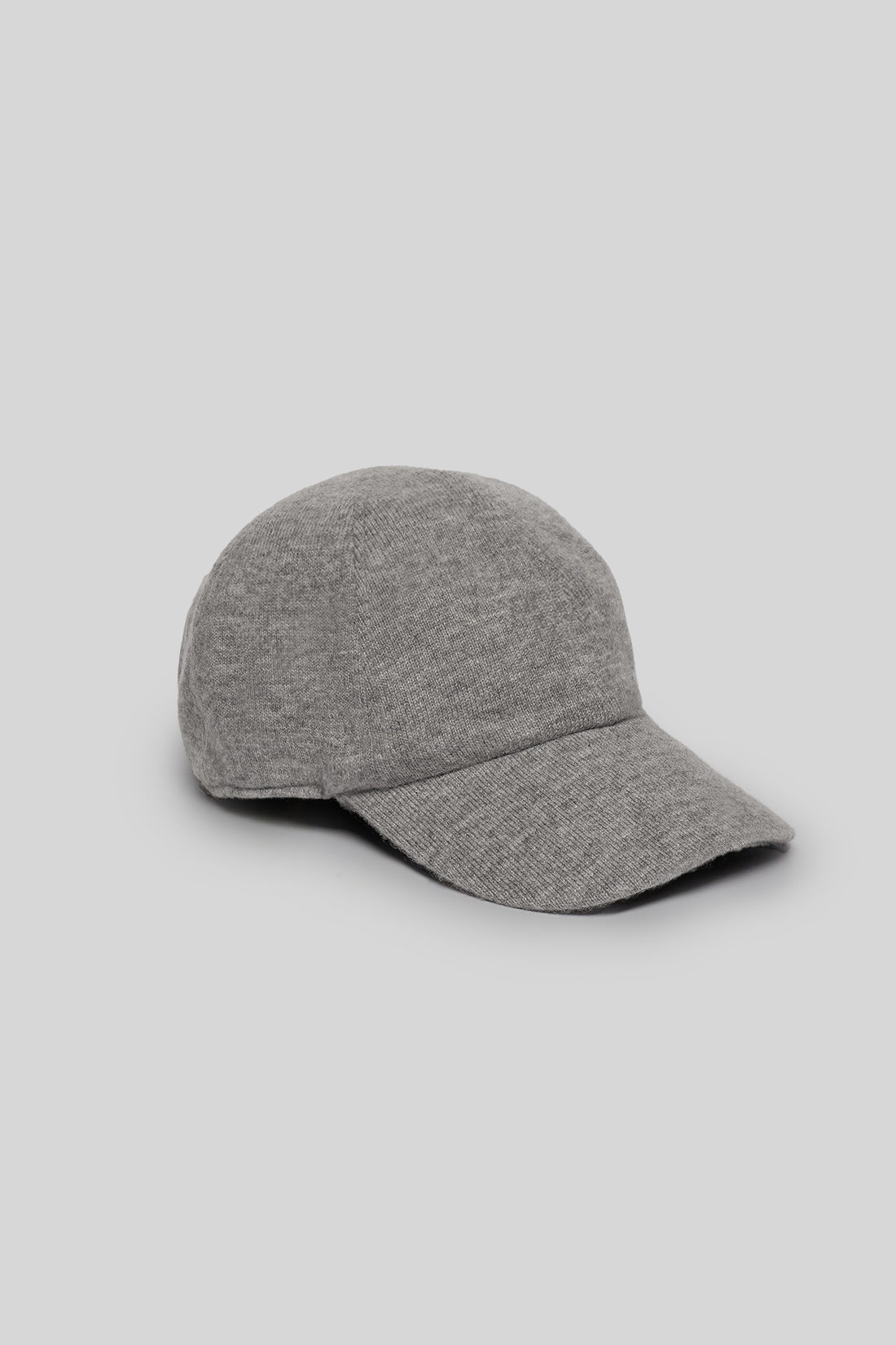 Gray knit baseball cap with ribbed brim on neutral background.