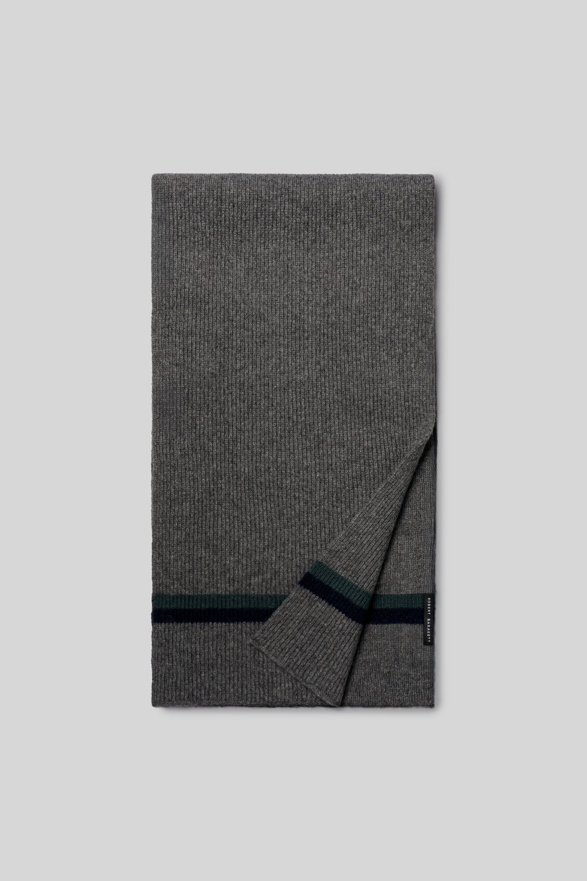 Gray ribbed knit scarf with dark green and navy horizontal stripes at one end, folded lengthwise.