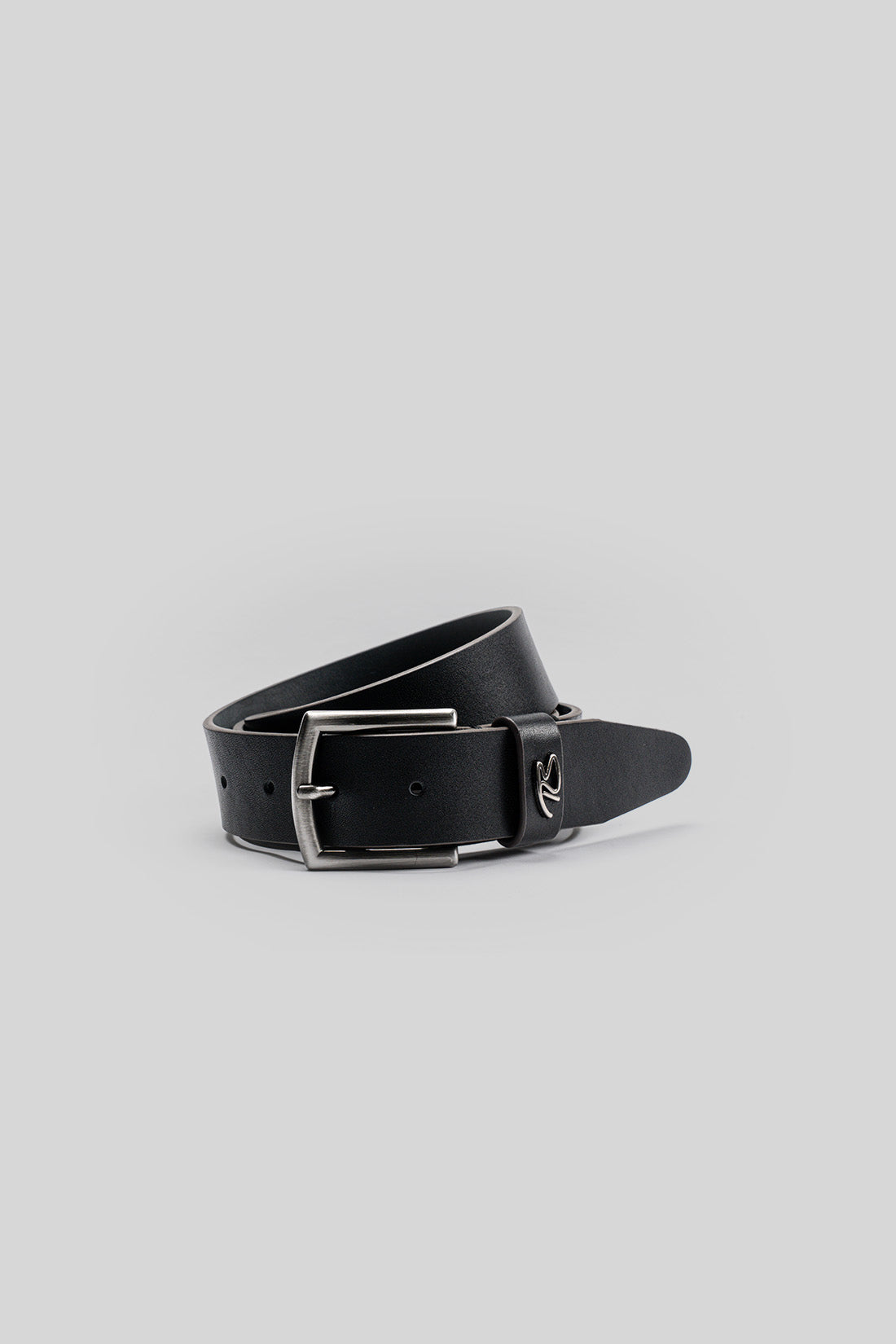 Black leather belt with silver rectangular buckle and perforated detailing along the length.