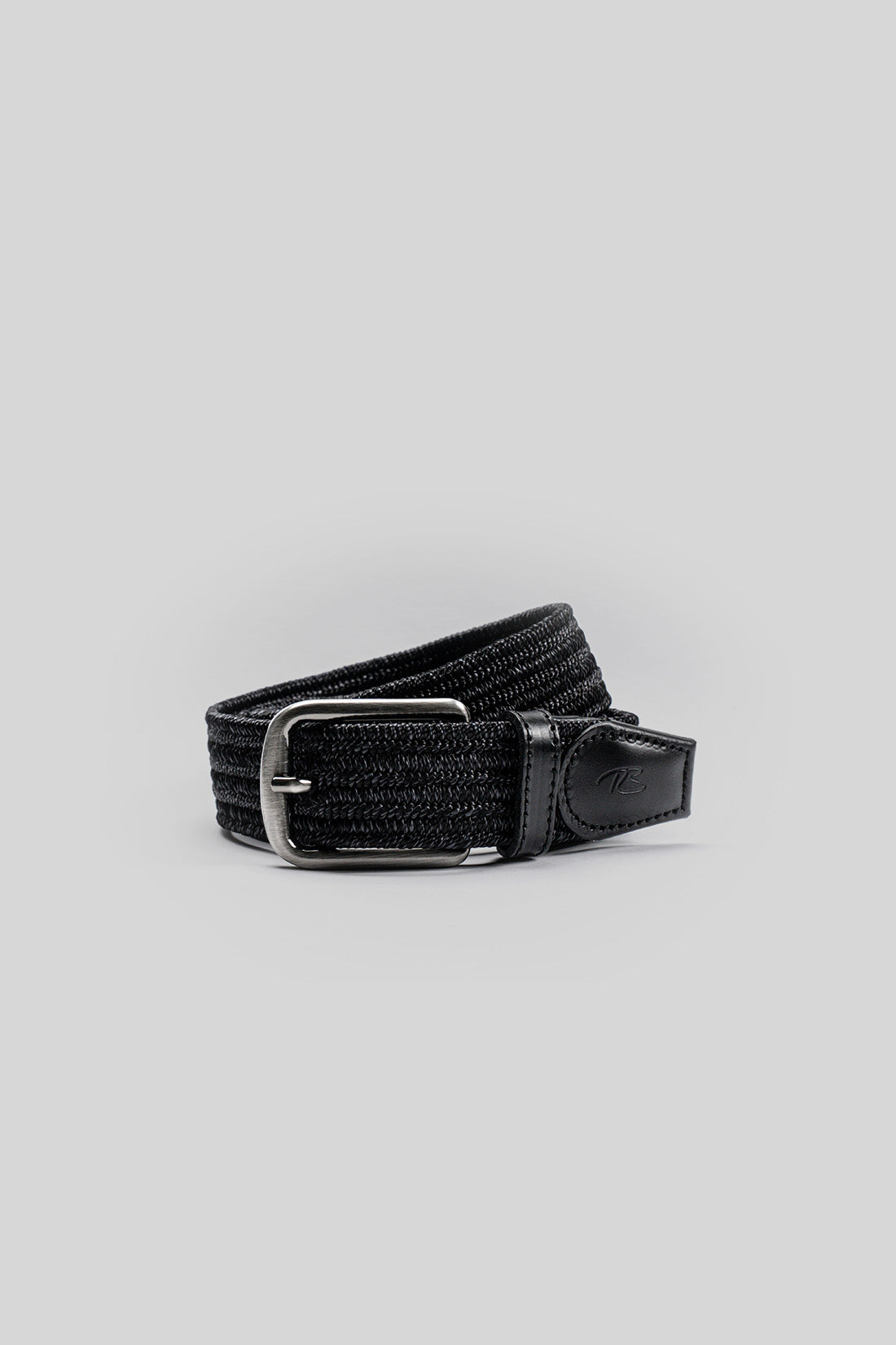 Black fabric belt with textured weave, silver-toned buckle, and leather end tab with embossed logo.
