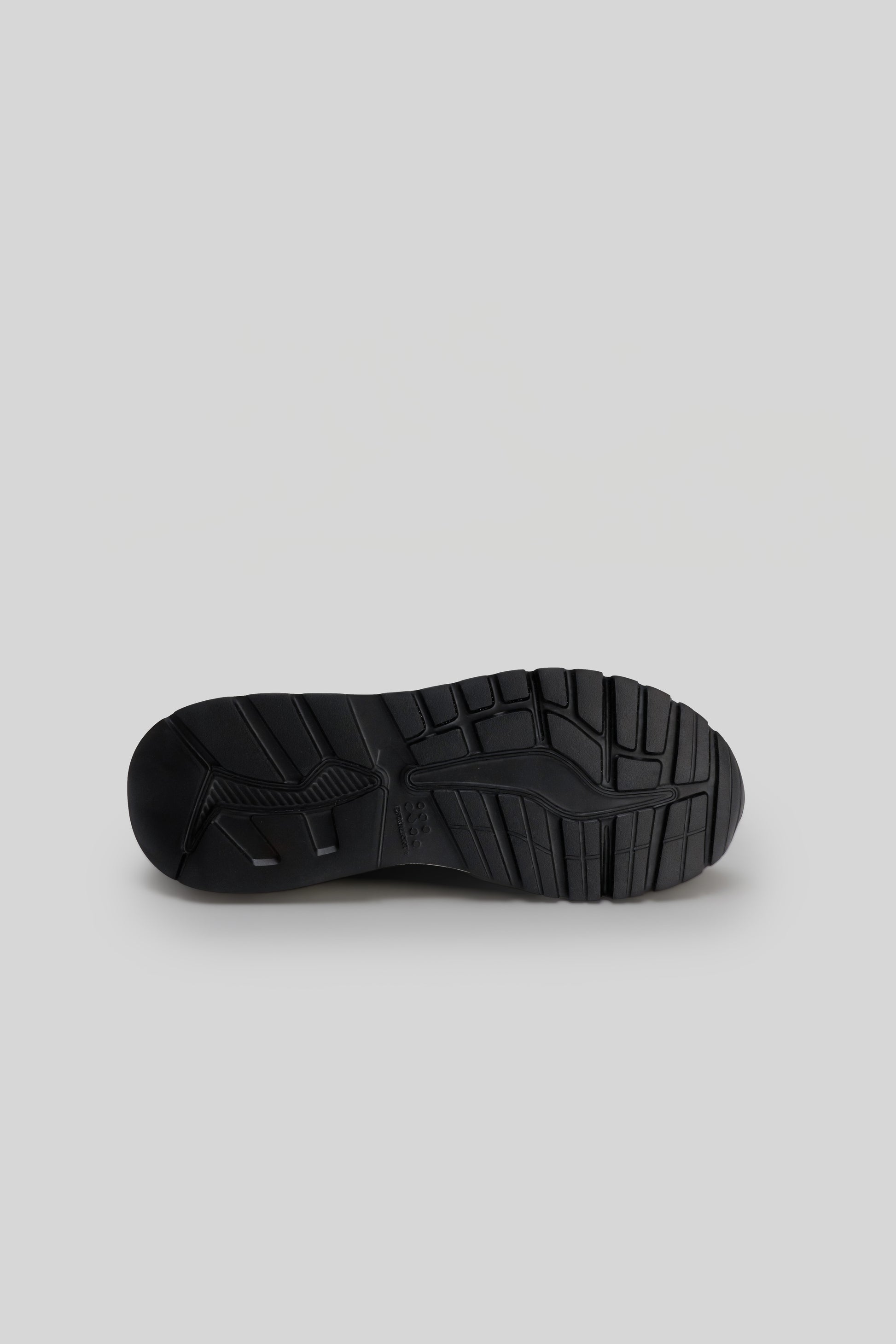 Black knit sneaker sole with textured tread pattern shown from bottom view.